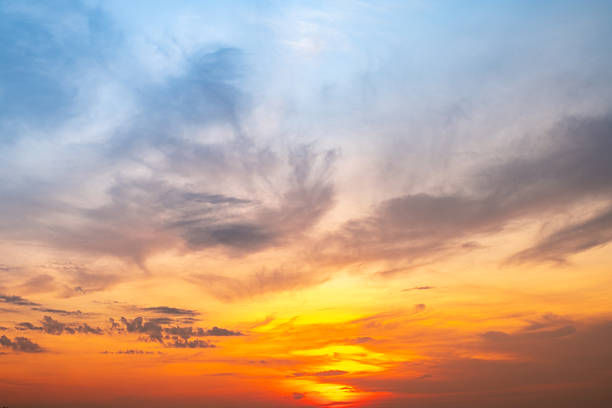 istock Beautiful , luxury soft gradient orange gold clouds and sunlight on the blue sky perfect for the background, take in evening,Twilight, Large size, high definition landscape photo 2212722453