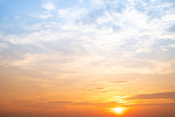 istock Beautiful , luxury soft gradient orange gold clouds and sunlight on the blue sky perfect for the background, take in evening,Twilight, Large size, high definition landscape photo 2212722486