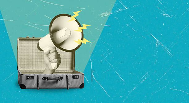 Hand holding megaphone emerging from vintage suitcase with blue background. Art collage.