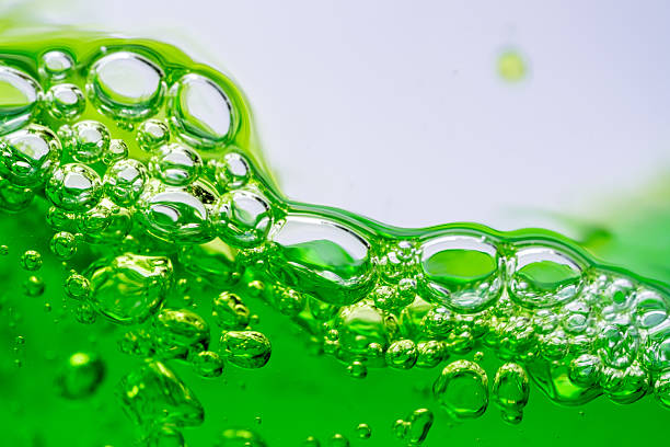 istock Water wave, close up of vibrant green liquid with bubbles, capturing dynamic movement and freshness. Perfect for backgrounds, beverages, or abstract concepts. soft drink 2212723161