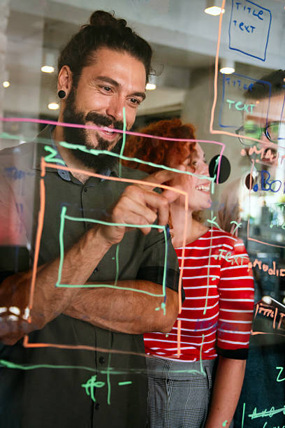 istock Software engineers working together on project at tech startup. Business designers working together 2212725553