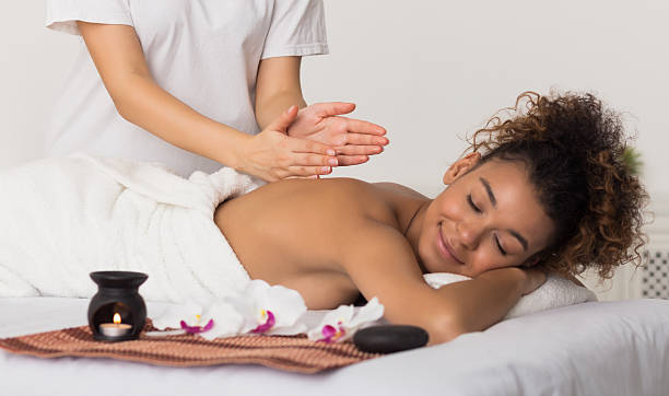istock Woman receiving back massage in spa salon 2212725616