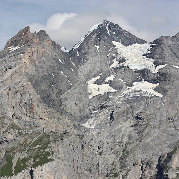 istock Snow-capped alpine peak with glacier 2212726577