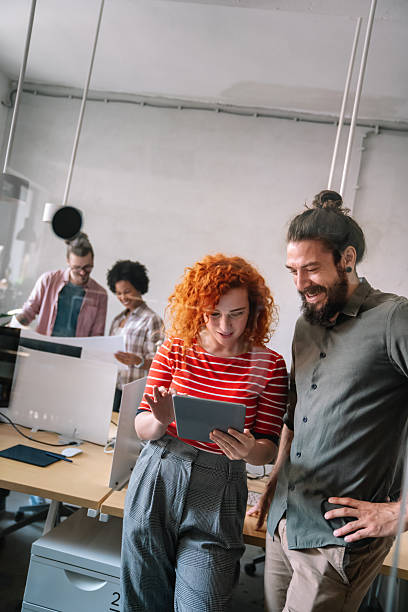 istock Group of business people and software developers working as a team in office 2212727998