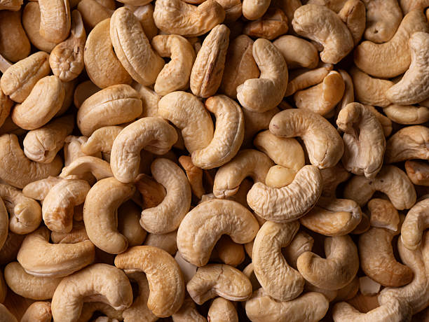 istock Full frame Cashew nuts background. Vegetarian Organic Healthy snack concept. 2212728903