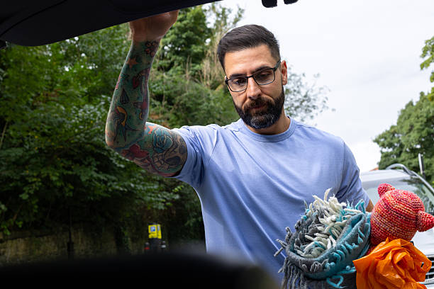 istock Point Of View Busy Dad Gathering Items from The Trunk 2212730275