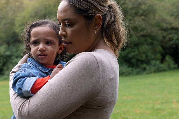 istock Mother Comforting Crying Baby 2212730405