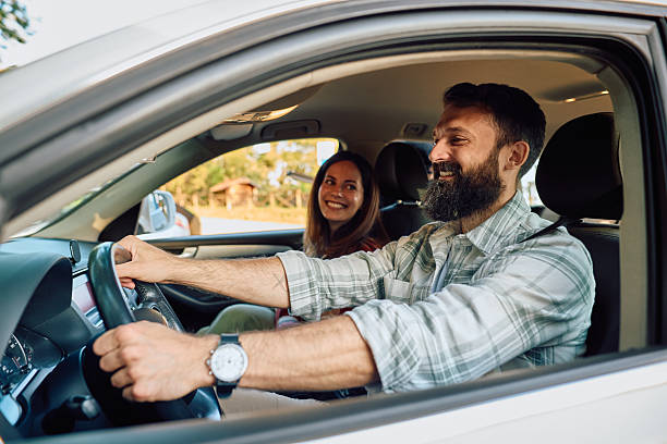 istock Couple driving and enjoying road trip together 2212731367