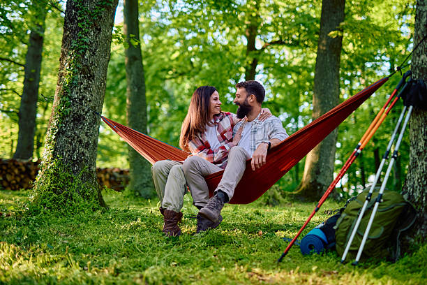 istock Couple relaxing in hammock during hike in forest 2212731789