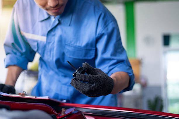 istock Asian technicians are checking the transmission fluid level to ensure it meets the standards 2212741354