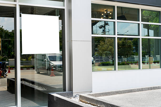 istock Blank poster on window glass template. Empty placard attached on window glass. 2212743662