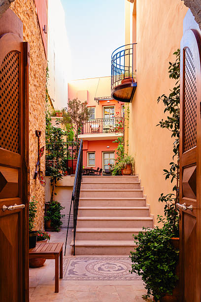 Charming alleyway with vibrant buildings and lush greenery in a historic town
