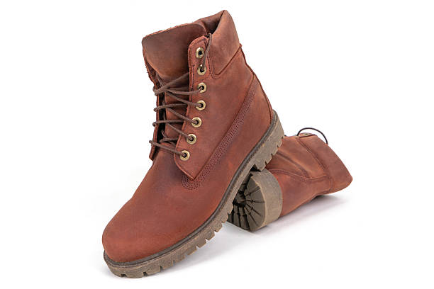 Pair of brown working boots isolated on white background.