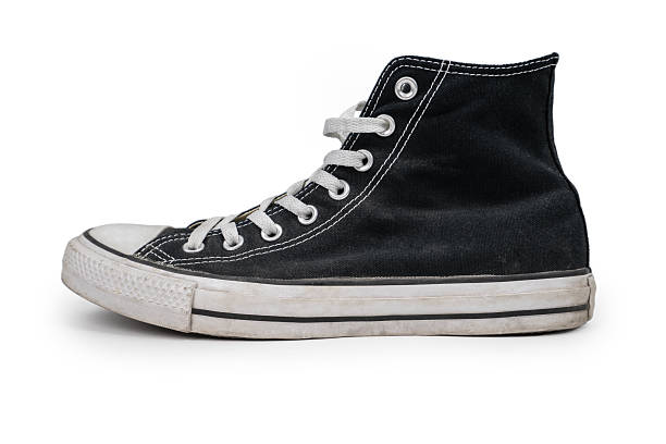istock Black sneakers isolated on white background, side view. 2212750282