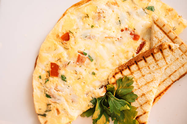 istock Omelette for breakfast with champignons and sauce 2212754820