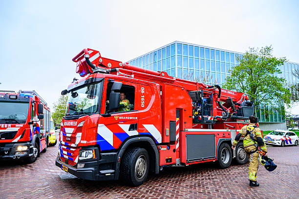 Fire engines and fire fighters at the scene of a fire in an apartment building in the city center of Zwolle.