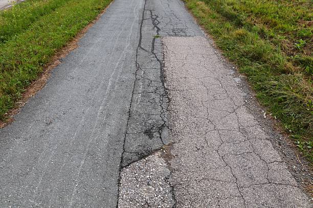 istock Broken countryside road in Austria 2212755597