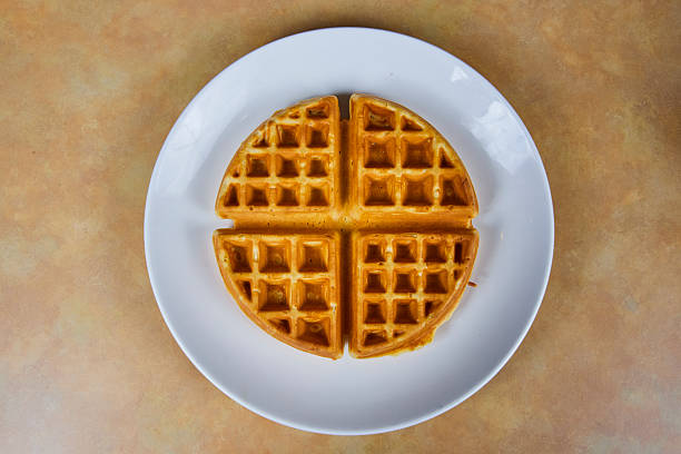 istock Golden Brown Waffle on White Plate, Top View Perspective 2212756081