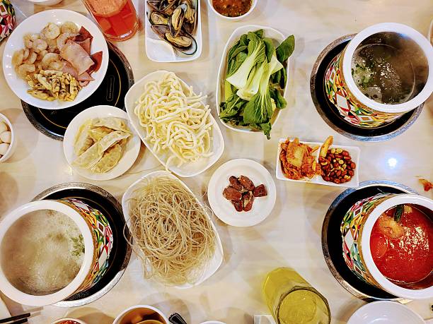 Communal Hot Pot Dining Experience with Fresh Ingredients, Overhead View