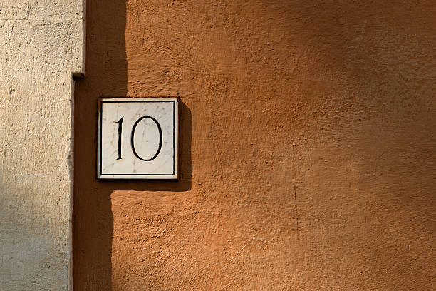 istock The number 10 on a wall of a building. 2212756577
