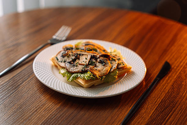 istock Belgian salty waffles with champignons on white plate 2212757561
