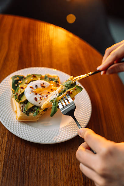 istock waffles with poached egg avocado on plate on wooden background 2212757610