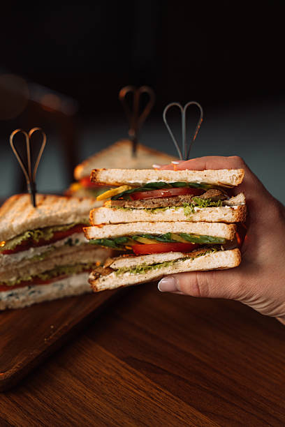 istock Sandwich in hand, healthy breakfasts 2212757711