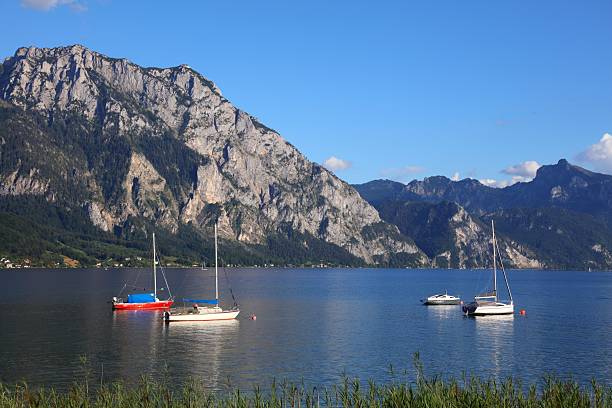 Sailboats on Traunsee mountain lake in Austrian Alps. Austria landscape in Salzkammergut region. Lake Traun.