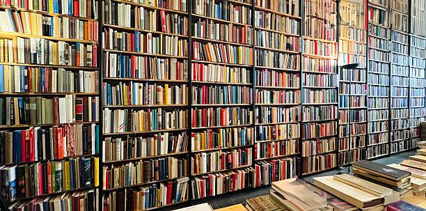 istock Bookshelves tightly packed with many old books 2212764667