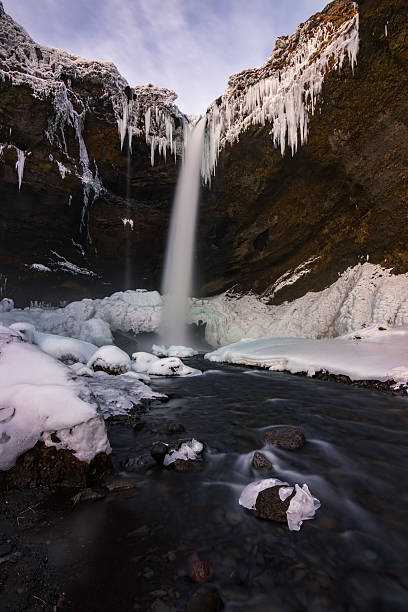 istock Snowed Kvernufoss waterfall in winter (Iceland) 2212764766
