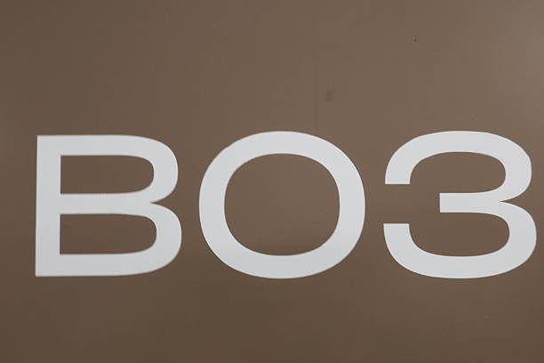 istock number B03 painted in white on the grey ground with copy space 2212766818