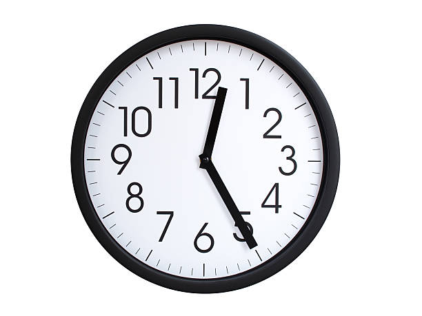 Wall clock with blue frame showing 12.25 00.25 or 12.25 O clock  on white background, suitable for time related articles, education, or punctuality concepts