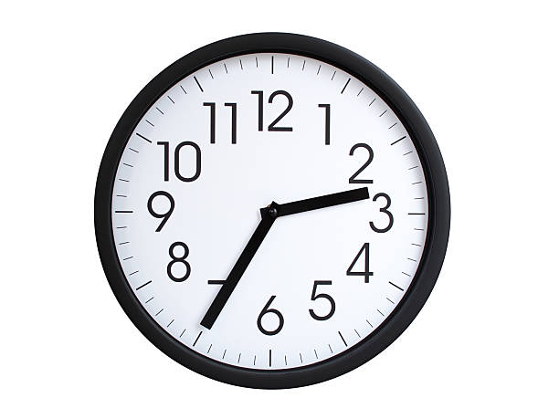 Simple round wall clock with black frame and white face, showing the time exactly at 02:35 or 14:35. Representing time precision in concepts of deadlines.
