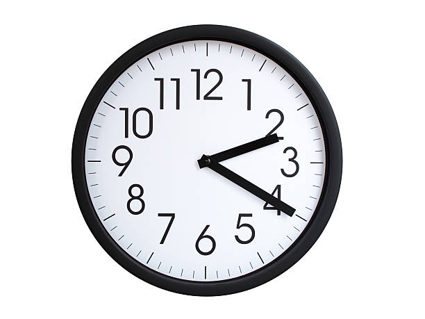 Simple round wall clock with black frame and white face, showing the time exactly at 02:20 or 14:20. Representing time precision in concepts of deadlines.