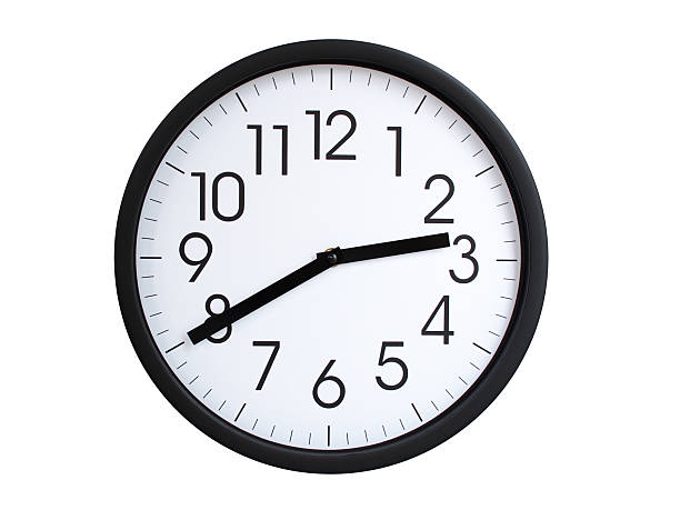 Simple round wall clock with black frame and white face, showing the time exactly at 02:40 or 14:40. Representing time precision in concepts of deadlines.