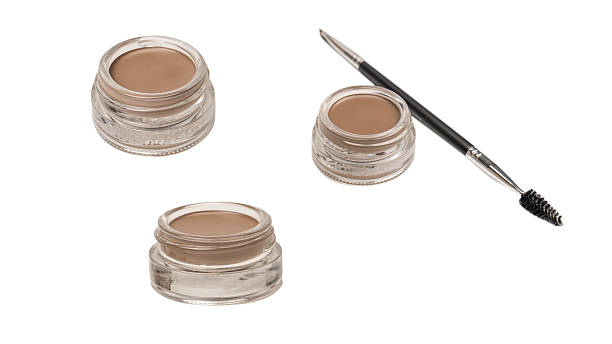 istock A brow pomade in blonde shade with brush isolated on a white background. 2212770493