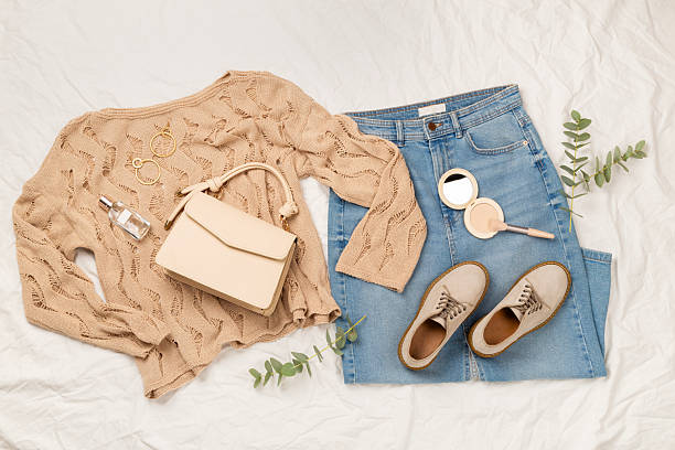 istock Flat lay with women's trendy spring outfit on white sheet background, top view 2212772424