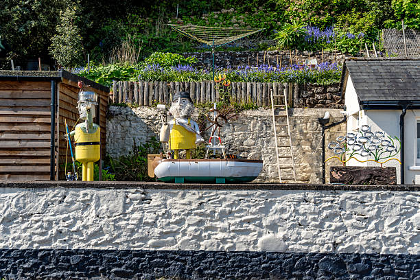 Minehead, UK. 29 April 2025. Garden characters wave at passers by in Minehead in Somerset