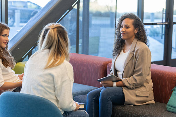 istock Diverse group of women meet for discussion in modern professional setting 2212777970