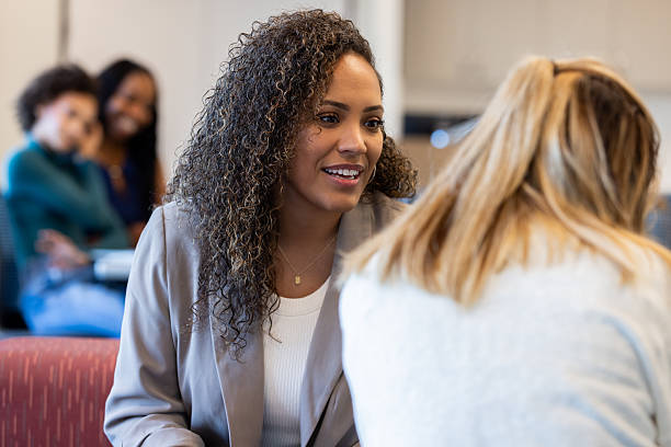 istock Diverse group of women meet for discussion in modern professional setting 2212777977