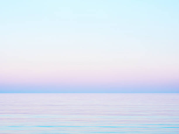 istock Pastel gradient sky and calm sea 2212782062
