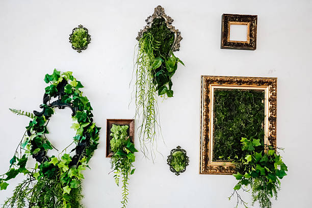 istock Decorative wall featuring greenery in ornate frames at a contemporary space 2212783719