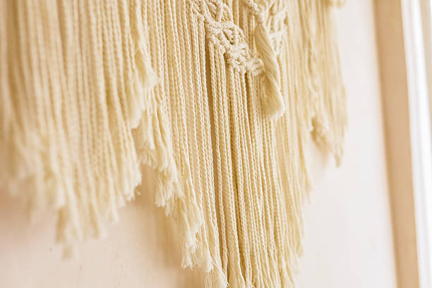 istock Intricate macrame wall hanging in a cozy indoor setting showcasing craft and texture 2212783948