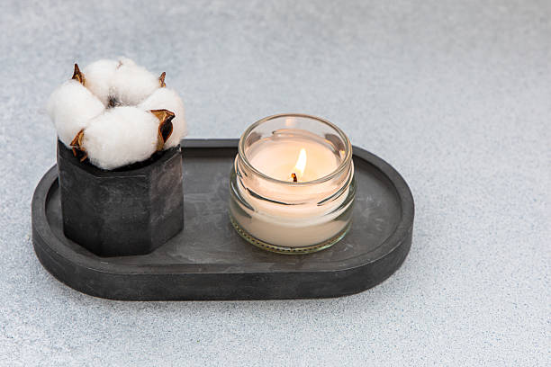 istock Decorative arrangement featuring cotton and candle in a modern setting 2212784011