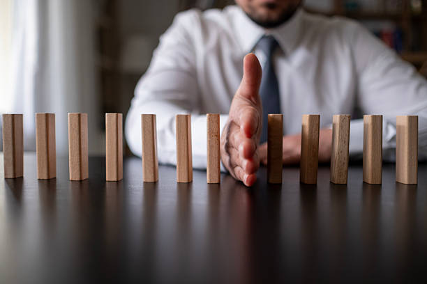 istock Protecting Assets From Domino Effect. Stop Loss Concept. 2212785602