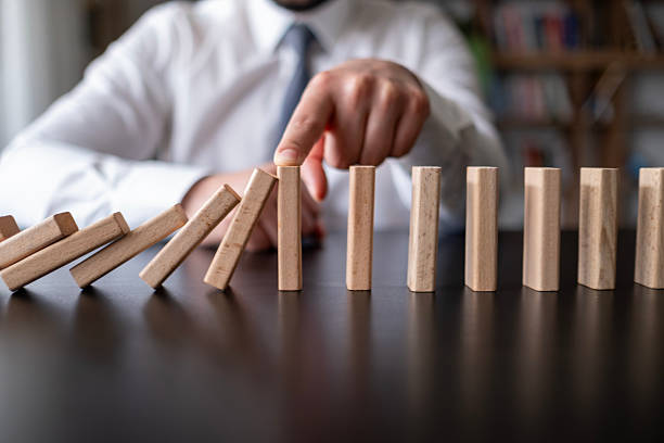 istock Protecting Assets From Domino Effect. Stop Loss Concept. 2212785663