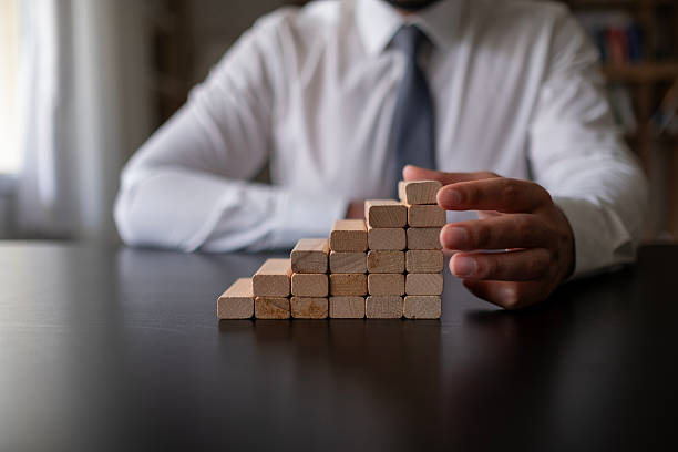 istock Businessman and Fingers climbing. Success concept. 2212786094