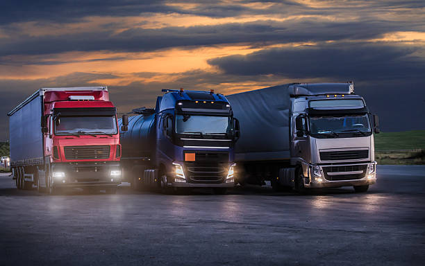 istock Trucks on asphalt in the evening under a cloudy sky 2212786205