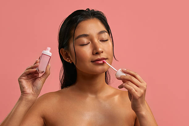 istock Young Asian woman on pastel pink background. 2212787837