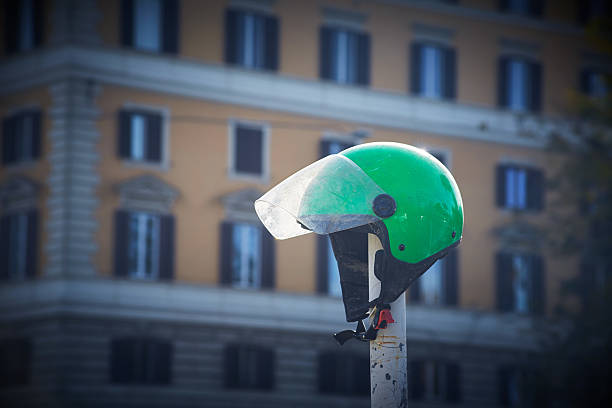 istock Green old dirty motorcycle scooter helmet 2212789615